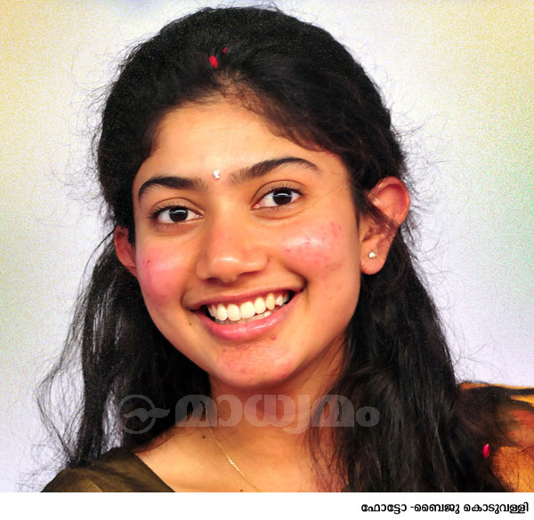 പൂക്കളങ്ങളെ സ്നേഹിക്കുന്ന പെണ്‍കുട്ടി